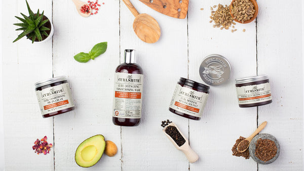 Four Curlsmith hair products on a white background 