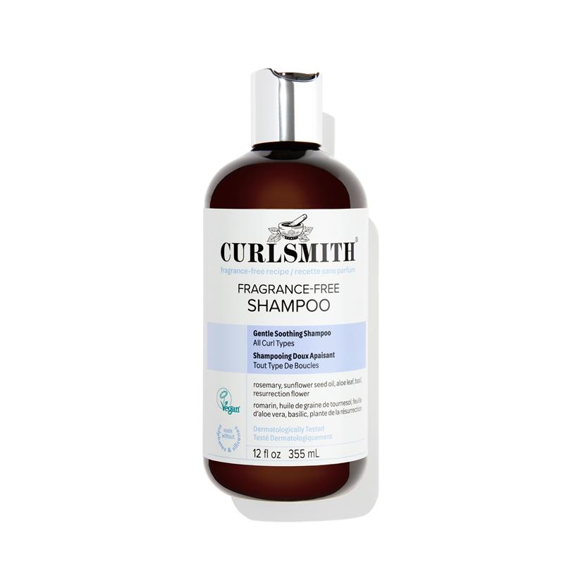 Bottle of Curlsmith fragrance-free shampoo on a white background