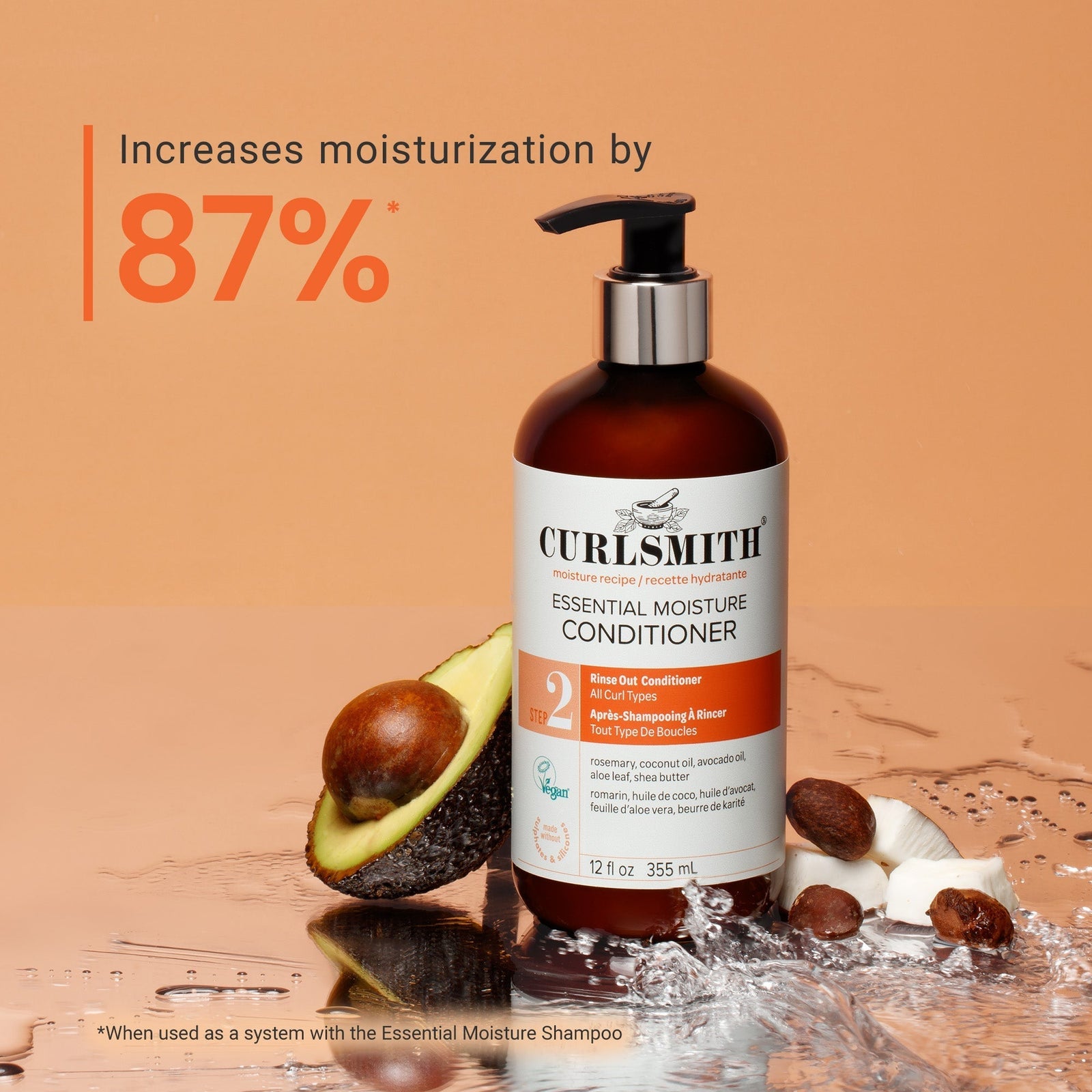 Curlsmith elemental moisture conditioner bottle with avocado and almonds on a brown background