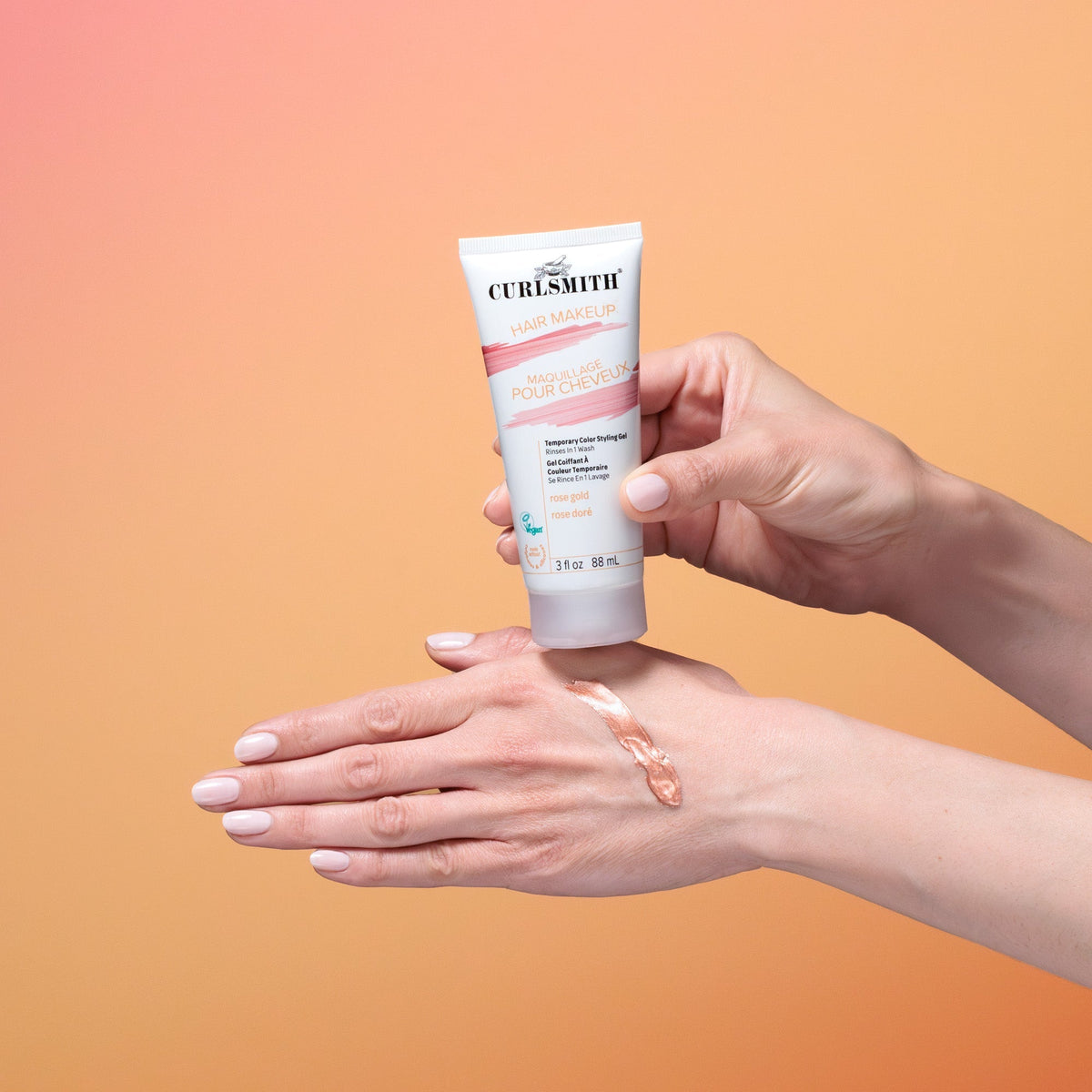 Person applying Curlsmith hair product to their hand against a gradient background