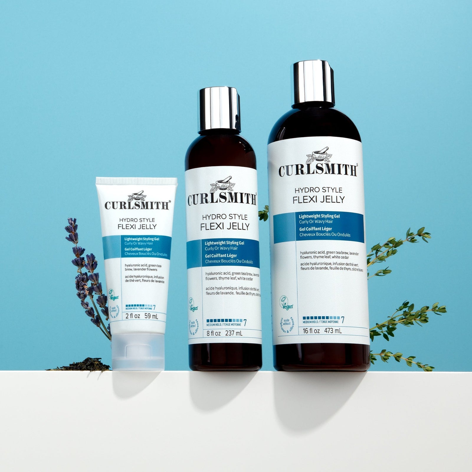 Curlsmith hair care products on a blue background