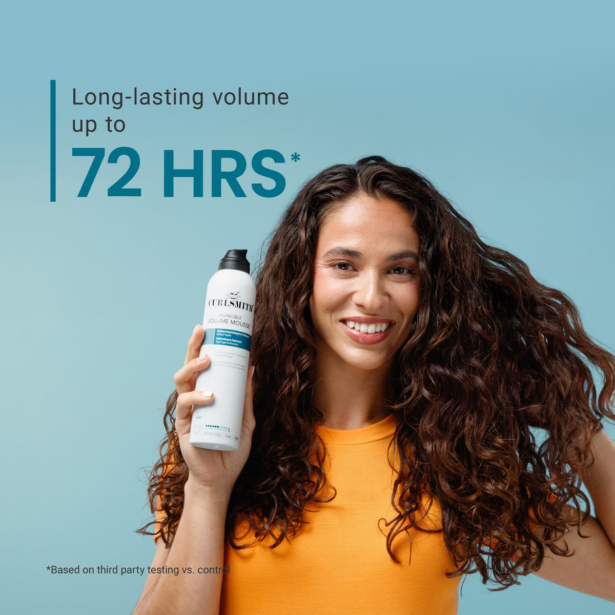 Woman holding a bottle of hair product with text about long-lasting volume on a blue background