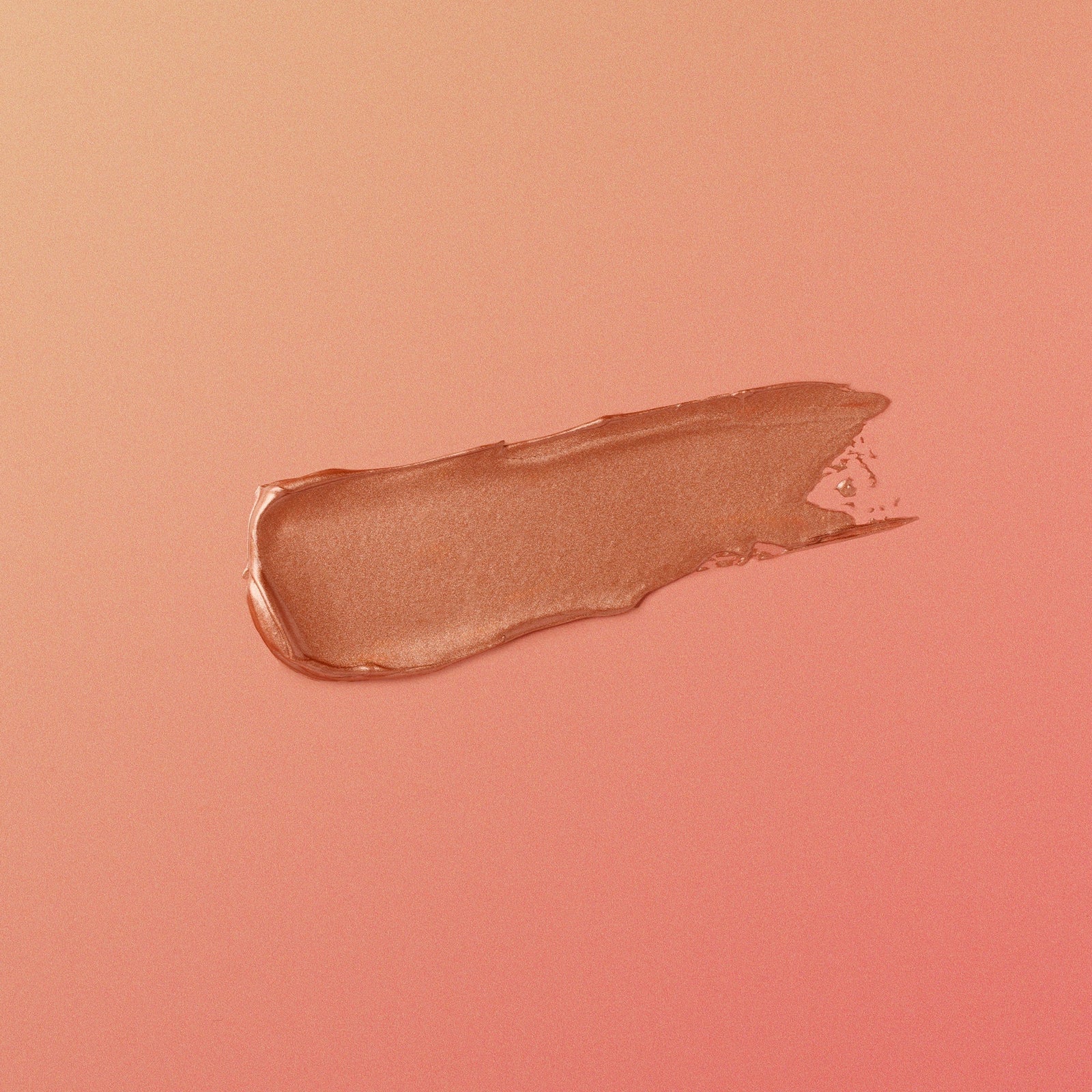 Nude-colored makeup swatch on a matching pink background
