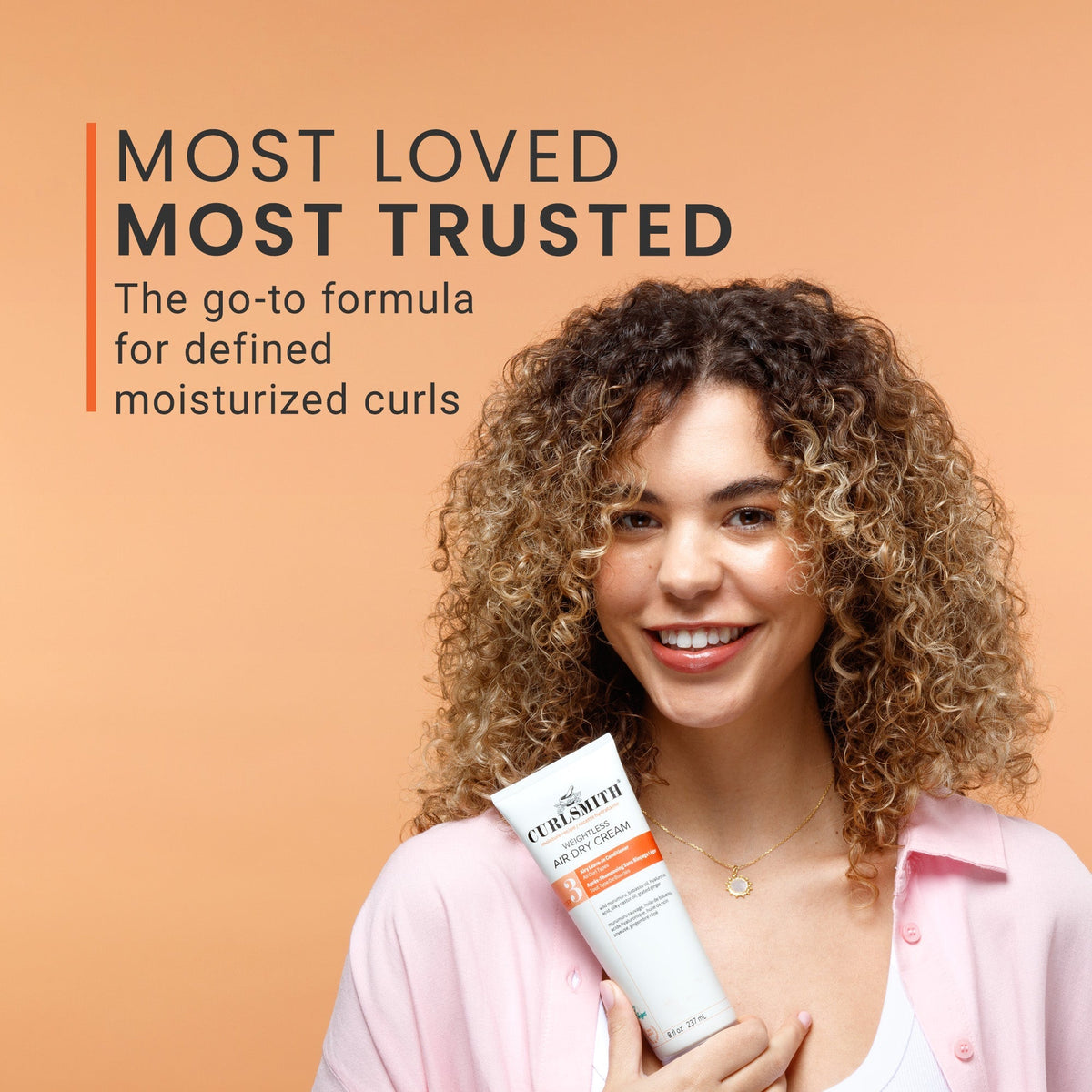 Woman holding a hair care product with text about the product's popularity and trustworthiness on an orange background