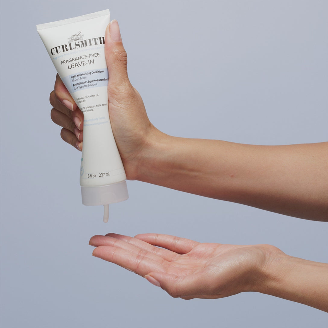 Person applying Curlsmith Fragrance-Free Leave-In