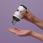 Person applying Curlsmith Core Strength Shampoo