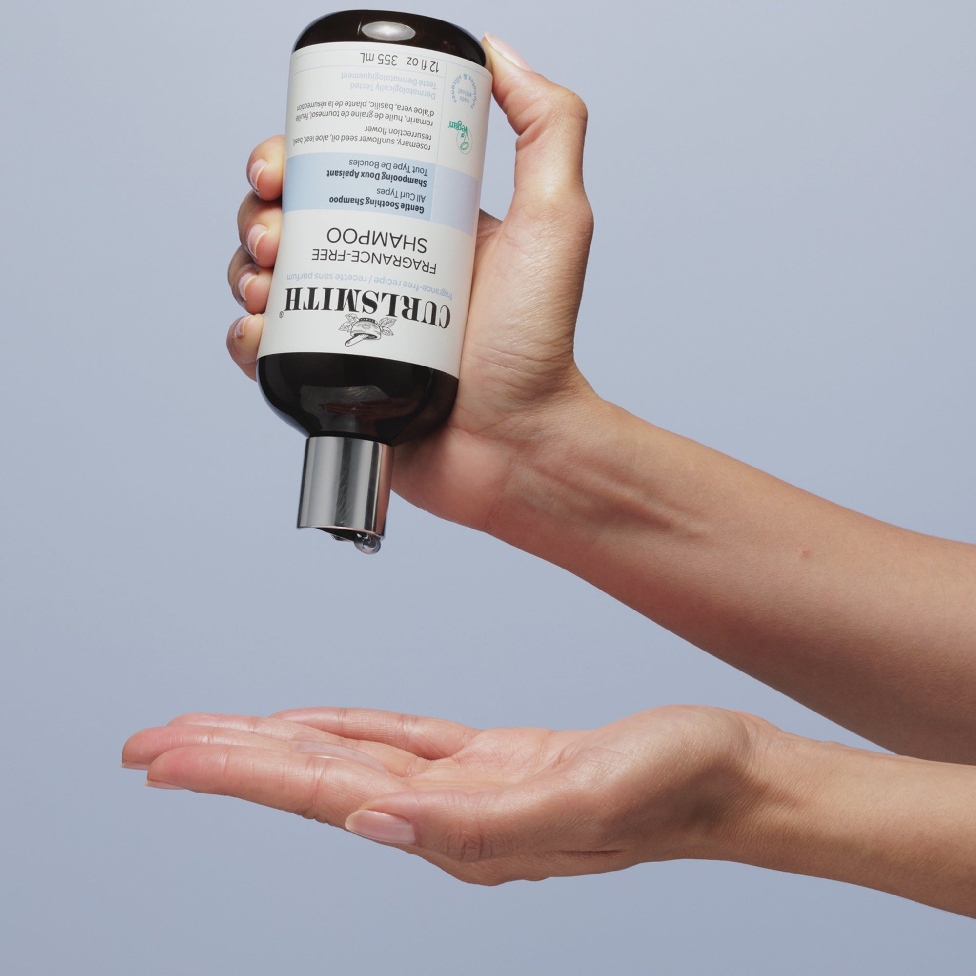 Person applying Curlsmith Fragrance-Free Shampoo