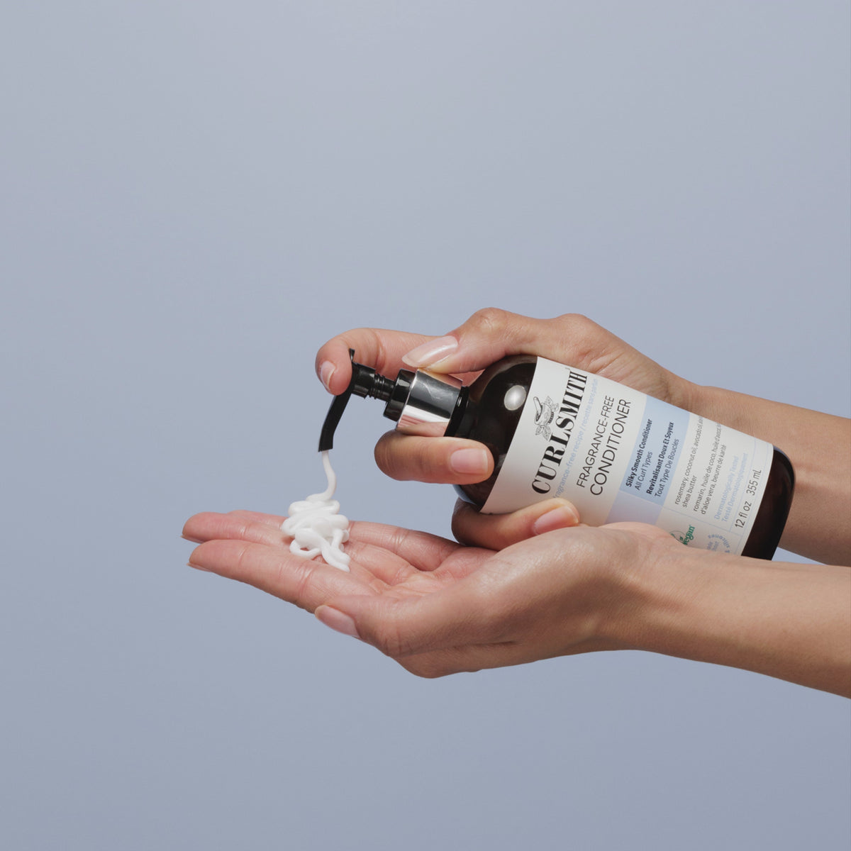 Person applying Curlsmith Fragrance-Free Conditioner