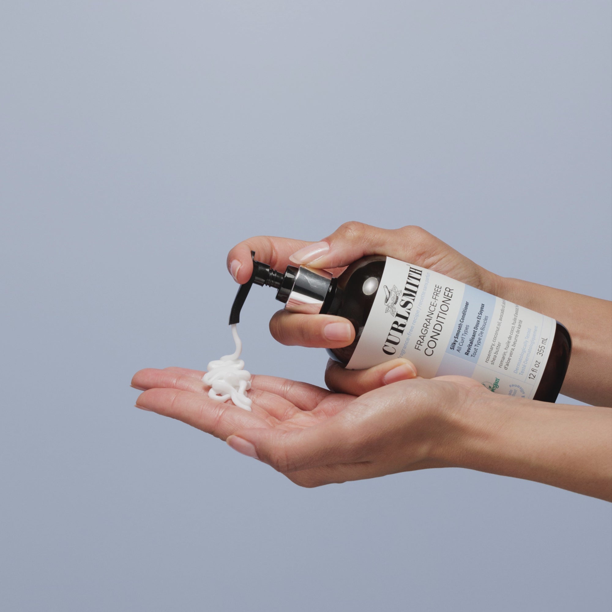 Person applying Curlsmith Fragrance-Free Conditioner