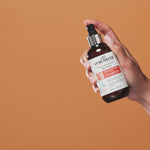 Hand holding Curlsmith Moisture Memory Release
