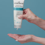 Person applying Curlsmith Feather-Light Protein Cream